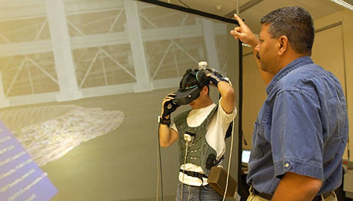 Professor Jayaram Sankar Works with a Student in the Virtual Reality Computer Integrated Manufacturing Laboratory.