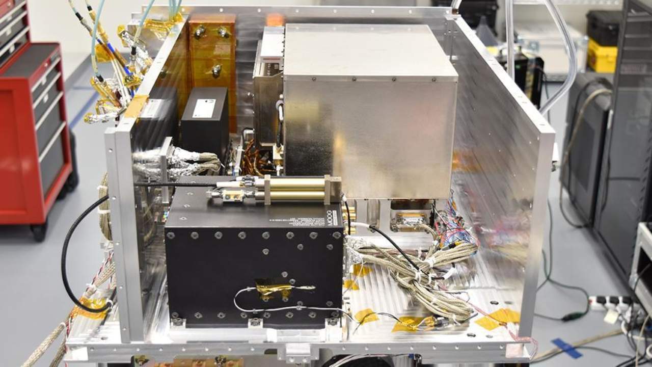 The Atomic Clock, GPS Receiver, and Ultra-Stable Oscillator which make up the Deep Space Atomic Clock Payload, following integration into the middle bay of Surrey Satellite US's Orbital Test Bed Spacecraft. Credits: Surrey Satellite Technology