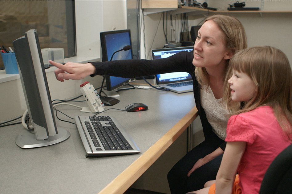 Richardson shows the brain scans to one of the children participating in the study.