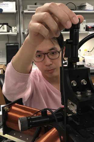 Rice alumnus Di (Daniel) Du adjusts electromagnets. Du and his Rice colleagues discovered what may be the simplest form of locomotion in their paramagnetic swimmers.