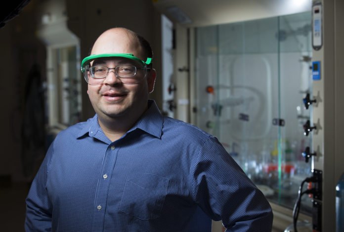 Javier Vela and the chemists in his research group have been working to produce semiconductors from materials that are safe, abundant and inexpensive to manufacture. Larger photo. Photo by Christopher Gannon and courtesy of the College of Liberal Arts and Sciences.