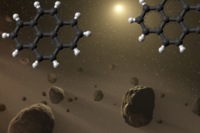 Pyrene molecules, which are four-ring, 16-carbon polycyclic hydrocarbons, are likely formed around giant stars. This artist's rendering shows the molecules in an asteroid belt, with carbon atoms shown in black and hydrogen atoms in white. Scientists have recreated the chemical steps for making pyrene in space. (Credit: NASA-JPL-Caltech)