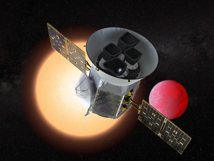 Illustration of the Transiting Exoplanet Survey Satellite (TESS) in front of a lava planet orbiting its host star. TESS will identify thousands of potential new planets for further study and observation. Credits: NASA/GSFC
