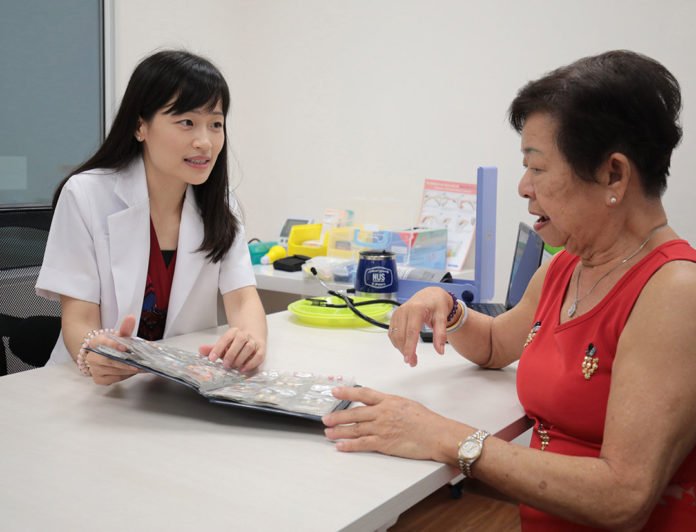 Associate Professor Joyce Lee with Madam Poh Kim Choo, who has type 2 diabetes. Madam Poh’s HbA1c (average blood sugar) improved within four months of participation in the pharmacist-managed diabetes service. Credit: National University of Singapore