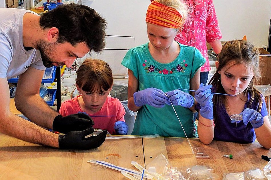 Amino has sold about 250 full kits, so far, to teachers and students, parents and children, museums, makers, artists, and researchers. The startup is also hoping to bring the kits to students in developing countries and to researchers that operate in areas without access to full biology labs. Pictured here, Amino co-founder Justin Pahara (left) teaches an Amino Labs workshop for home-schooled students, aged 6 to 16, in the the rural Haliburton area of Ontario, Canada.
