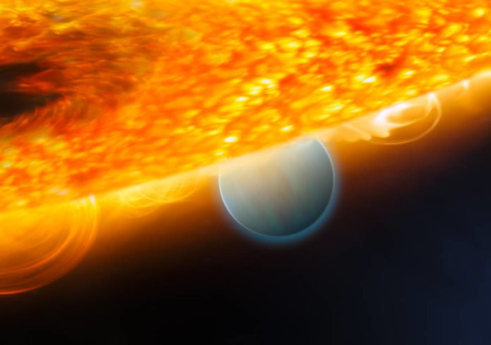 This is an artist's impression of the Jupiter-size extrasolar planet, HD 189733b, being eclipsed by its parent star. Astronomers using the Hubble Space Telescope have measured carbon dioxide and carbon monoxide in the planet's atmosphere. The planet is a 