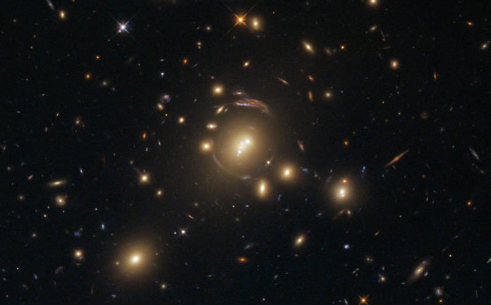 This image, taken with the Wide Field Camera 3 (WFC3) on board the NASA/ESA Hubble Space Telescope, shows the galaxy cluster SDSS J1336-0331. Image credit: NASA / ESA / Hubble.
