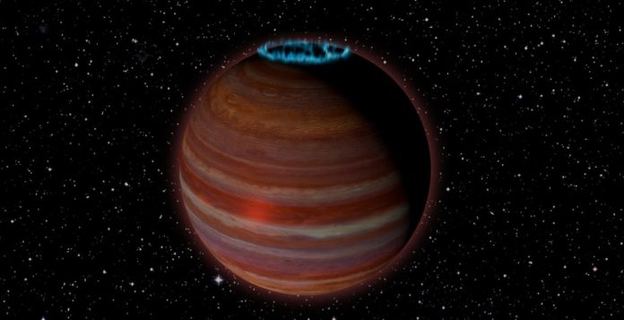 Artist's conception of SIMP J01365663+0933473, an object with 12.7 times the mass of Jupiter, but a magnetic field 200 times more powerful than Jupiter's. This object is 20 light-years from Earth. Credit: Caltech/Chuck Carter; NRAO/AUI/NSF