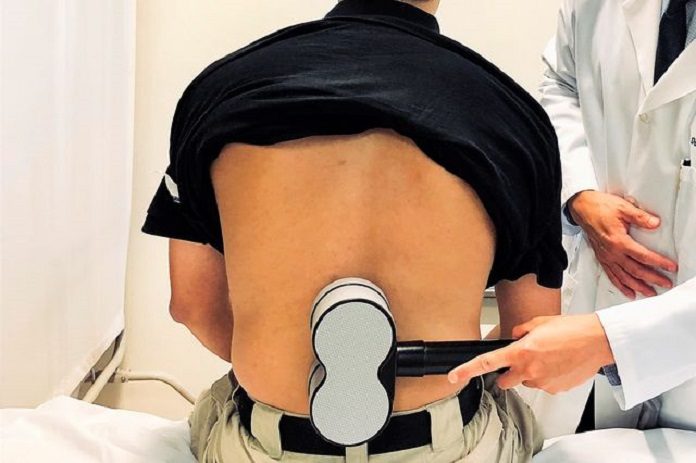 UCLA neuroscientists, led by Dr. Daniel Lu, stimulated the lower spinal cord through the skin with a magnetic device placed at the lumbar spine.