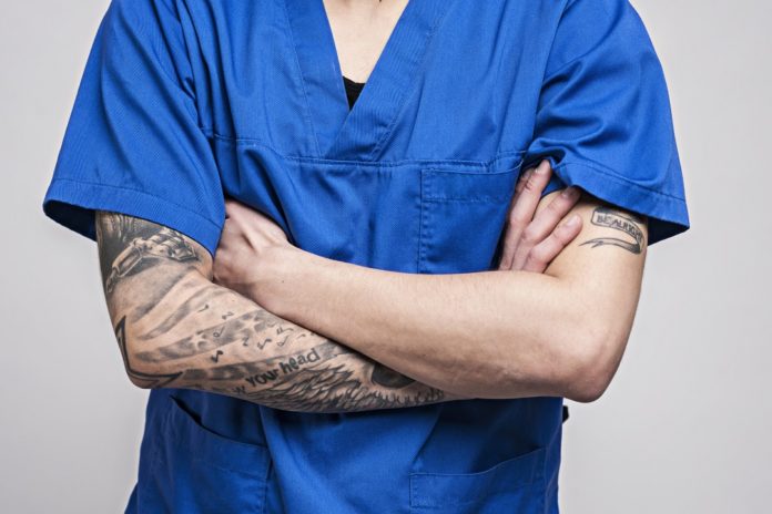 Young doctor with tattoo's