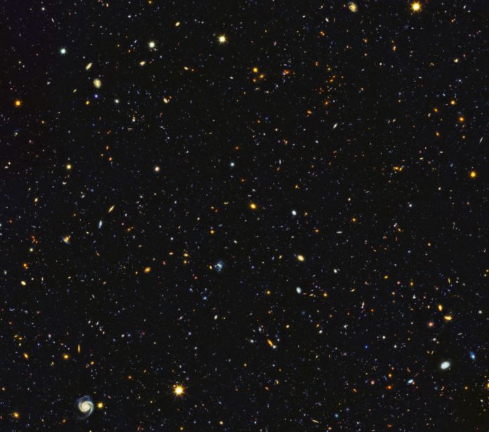 Astronomers have just assembled one of the most comprehensive portraits yet of the universe’s evolutionary history, based on a broad spectrum of observations by the Hubble Space Telescope and other space and ground-based telescopes. In particular, Hubble’s ultraviolet vision opens a new window on the evolving universe, tracking the birth of stars over the last 11 billion years back to the cosmos’ busiest star-forming period, about 3 billion years after the big bang. This photo encompasses a sea of approximately 15,000 galaxies — 12,000 of which are star-forming — widely distributed in time and space. This mosaic is 14 times the area of the Hubble Ultra Violet Ultra Deep Field released in 2014. Credits: NASA, ESA, P. Oesch (University of Geneva), and M. Montes (University of New South Wales)