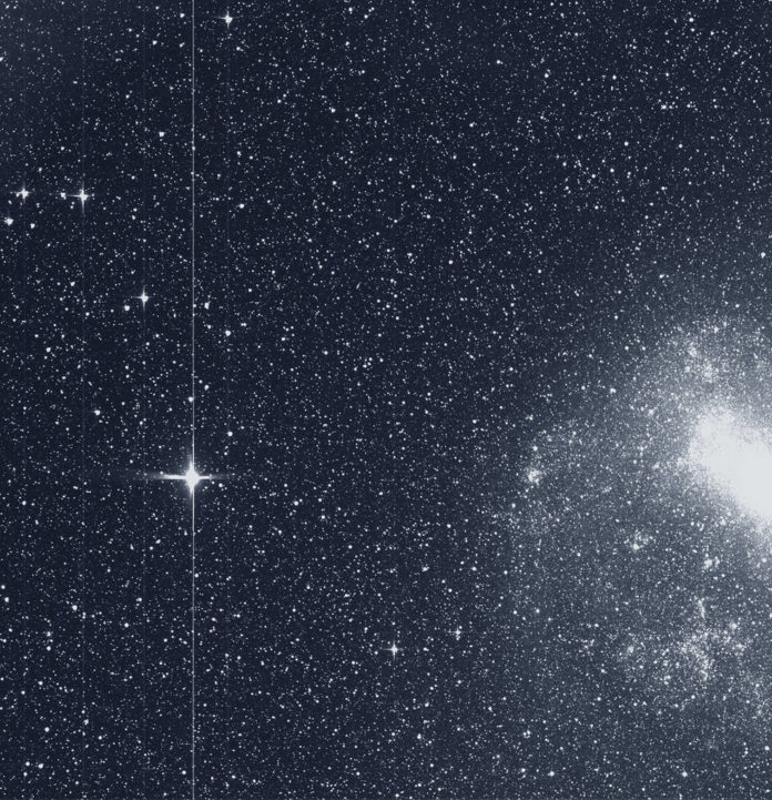 The Transiting Exoplanet Survey Satellite (TESS) took this snapshot of the Large Magellanic Cloud (right) and the bright star R Doradus (left) with just a single detector of one of its cameras on Tuesday, Aug. 7. The frame is part of a swath of the southern sky TESS captured in its “first light” science image as part of its initial round of data collection. Credits: NASA/MIT/TESS