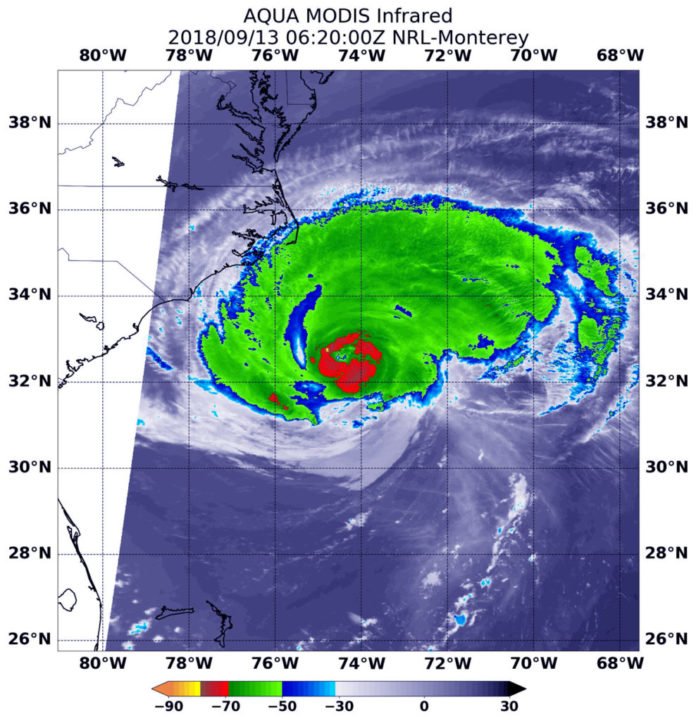At 2:20 a.m. EDT (0620 UTC) on Sept. 13, the MODIS instrument aboard NASA’s Aqua satellite looked at Hurricane Florence in infrared light. MODIS found a small ring of coldest cloud top temperatures around the eye, as cold as or colder than minus 80 degrees (yellow) Fahrenheit (minus 112 degrees Celsius). Surrounding the eye were thick rings of powerful storms with cloud tops as cold as or colder than minus 70 degrees (red) Fahrenheit (minus 56.6 degrees Celsius). Credit: NASA/NRL