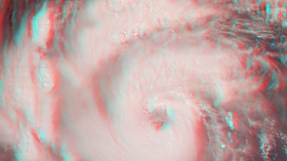 MISR's stereo anaglyph shows a three-dimensional view of Michael and combines two of MISR's nine camera angles. Using 3D red-blue glasses, you can see the 3D effect. Apparent in the 3D stereo anaglyph as well as the height field are a number of bright “clumps.” These are groups of strong thunderstorms embedded within the larger circulation of the hurricane. Credits: NASA/GSFC/LaRC/JPL-Caltech, MISR Team