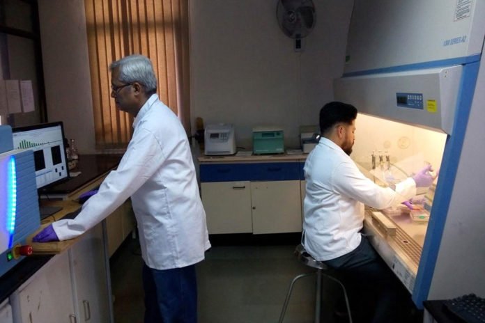 Dr. Dheeman Sarkar and Dr. S. Chakrabarty working in the lab