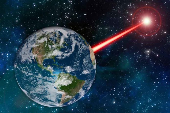 An MIT study proposes that laser technology on Earth could emit a beacon strong enough to attract attention from as far as 20,000 light years away