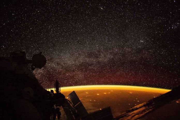 There is an eerie orange glow above Earth