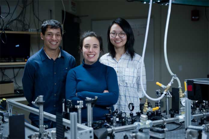 Professor Gabriela S. Schlau-Cohen (center) and graduate students Raymundo Moya (left) and Wei Jia Chen worked with collaborators at the University of Verona, Italy, to develop a new understanding of the mechanisms by which plants reject excess energy they absorb from sunlight so it doesn’t harm key proteins. The insights gained could one day lead to critically needed increases in yields of biomass and crops. Photo: Stuart Darsch