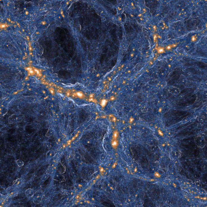 Simulation of galaxies and gas in the universe. Within the gas in the (blue) filaments connecting the (orange) galaxies lurk rare pockets of pristine gas – vestiges of the Big Bang that have somehow been orphaned from the explosive, polluting deaths of stars, seen here as circular shock waves around some orange points. CREDIT: TNG COLLABORATION