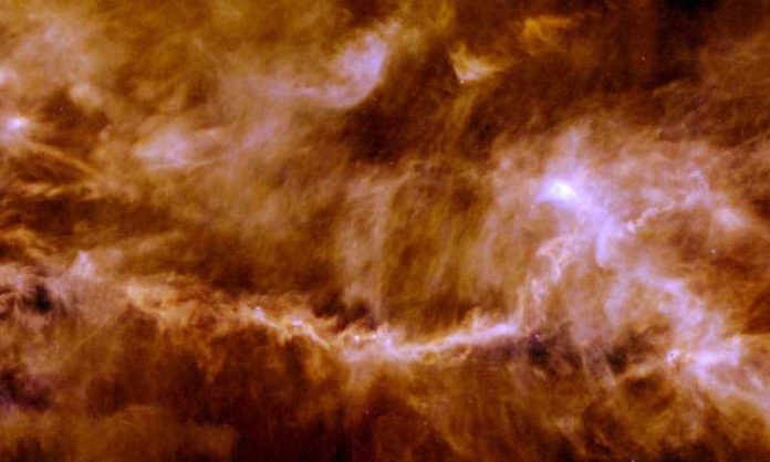 The Taurus Molecular Cloud, pictured here by ESA's Herschel Space Observatory, is a star-forming region about 450 light-years away. The image frame covers roughly 14 by 16 light-years and shows the glow of cosmic dust in the interstellar material that pervades the cloud, revealing an intricate pattern of filaments dotted with a few compact, bright cores -- the seeds of future stars. Credit: ESA/Herschel/PACS, SPIRE/Gould Belt survey Key Programme/Palmeirim et al. 2013