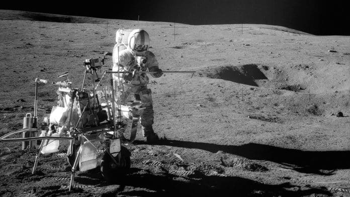 Apollo 14 Astronaut Alan B. Shepard Jr. assembles equipment on the lunar surface in Feburary 1971. Credit: NASA