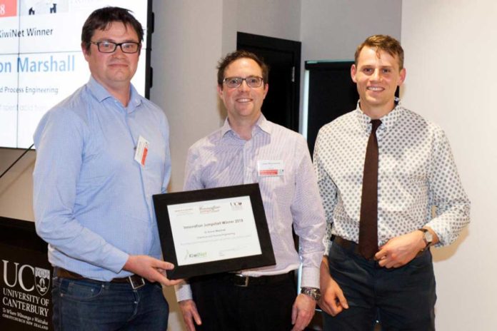 Dr Aaron Marshall (left), and Chemical and Process Engineering Master’s student Jonathan Ring (right) receive their Innovation Jumpstart award from KiwiNet CEO James Hutchinson.