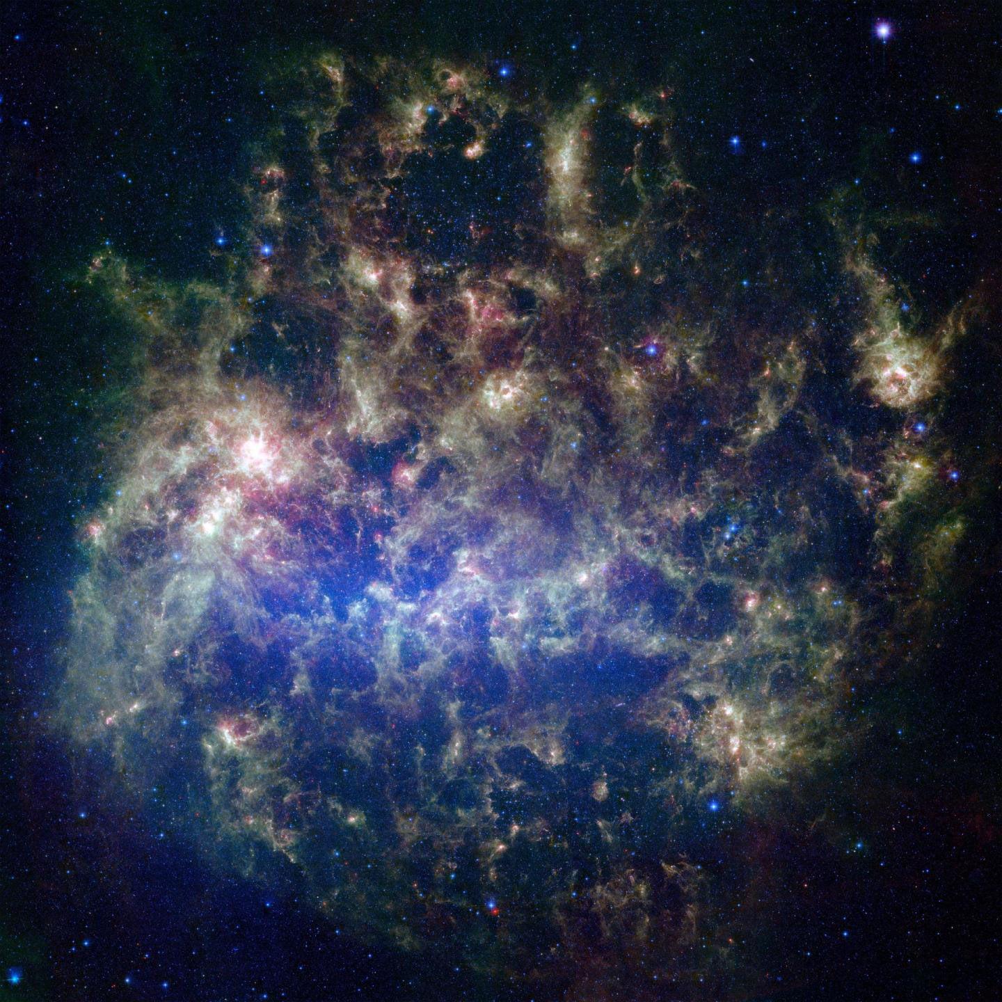 This vibrant image from NASA's Spitzer Space Telescope shows the Large Magellanic Cloud, a satellite galaxy to our own Milky Way galaxy.  CREDIT NASA/JPL-Caltech/STScI