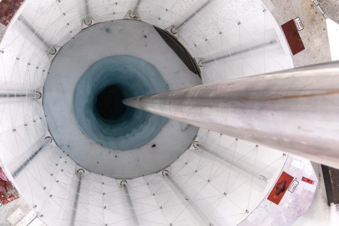 Researchers used a hot-water drill to bore through a kilometre of ice, creating a portal with a diameter of just 60 centimetres. Credit: Billy Collins/SALSA Science Team