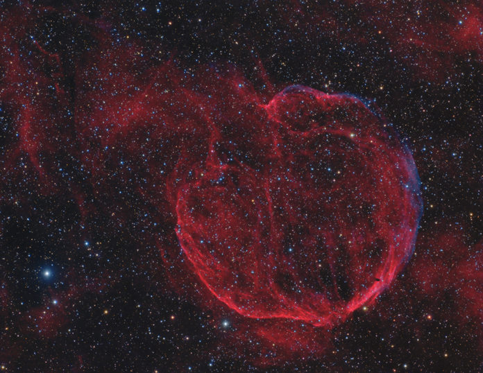 CTB 1, seen here in a deep exposure that highlights visible light from hydrogen gas, is the expanding wreckage of a massive star that exploded some 10,000 years ago. The pulsar formed in the center of the collapsing star is moving so fast it has completely exited the faint shell. Credit: Copyright Scott Rosen, used with permission