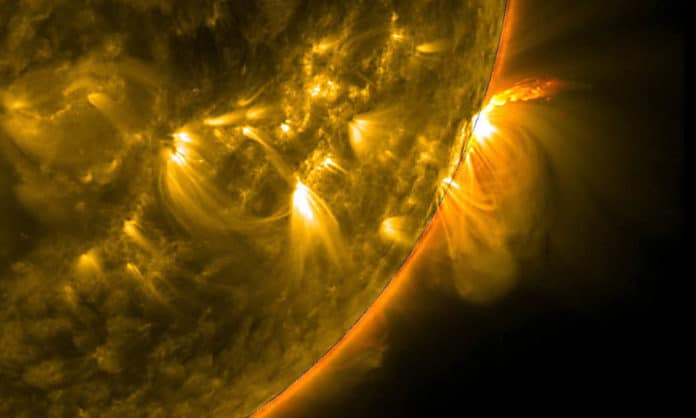 Erupting plasma loops are seen above the surface of the sun. Plasma is the most abundant form of matter in the universe, and Rochester scientists are finding new ways to observe and create plasmas. (NASA/SDO photo)