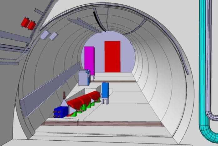 This computer drawing shows the FASER instrument in a tunnel at CERN’s Large Hadron Collider in Geneva, Switzerland. The detector will be precisely aligned with the collision axis in the ATLAS instrument 480 meters away. FASER will track and measure the decay of particles produced.FASER/CERN