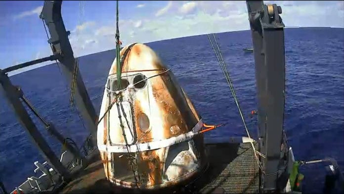 SpaceX’s Crew Dragon spacecraft is safely aboard the company’s recovery vessel, Go Searcher, following splashdown at 8:45 a.m. EST on Friday, March 8, 2019. Image credit: NASA TV