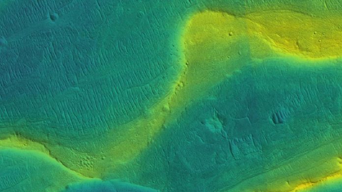 A photo of a preserved river channel on Mars with color overlaid to show different elevations (blue is low, yellow is high). Courtesy of NASA/JPL/Univ. Arizona/UChicago