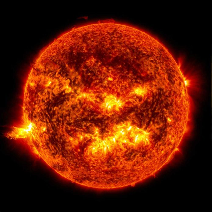 This image shows the bright light of a solar flare on the left side of the sun and an eruption of the solar material shooting through the sub's atmosphere, called a prominence eruption. Credit: NASA/Goddard/SDO