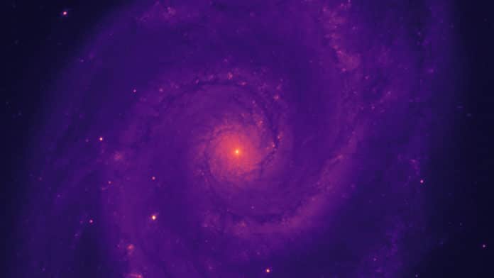 DESI “first light” image of the Whirlpool Galaxy, also known as Messier 51. This image was obtained the first night of observing with the DESI Commissioning Instrument on the Mayall Telescope at the Kitt Peak National Observatory in Tucson, Arizona; an r-band filter was used to capture the red light from the galaxy. (Credit: DESI Collaboration)