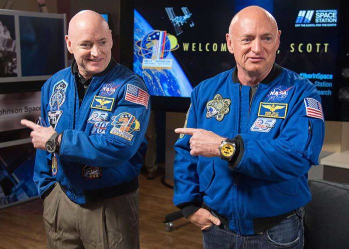 Mark Kelly, at right, is about six minutes older than his identical twin, Scott.Credit: NASA/Alamy