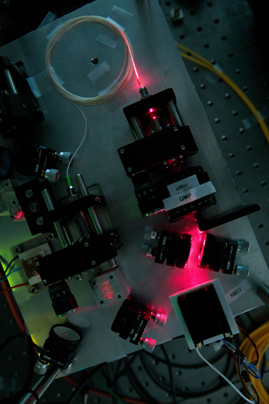 Pictured here is a device developed in the NUS‐Singtel Cyber Security R&D Lab that creates particles of light, known as photons that are connected by the quantum property of entanglement. (Credit: National University of Singapore) 