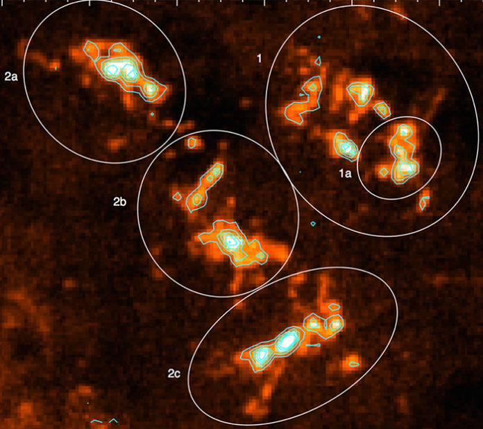 This image from a radio telescope shows a huge star-forming region of the outer Milky Way galaxy. The ovals identify the main subdivisions of the region's molecular cloud, including the smaller 1a, which is very efficient at producing stars. Image courtesy of Charles Kerton.