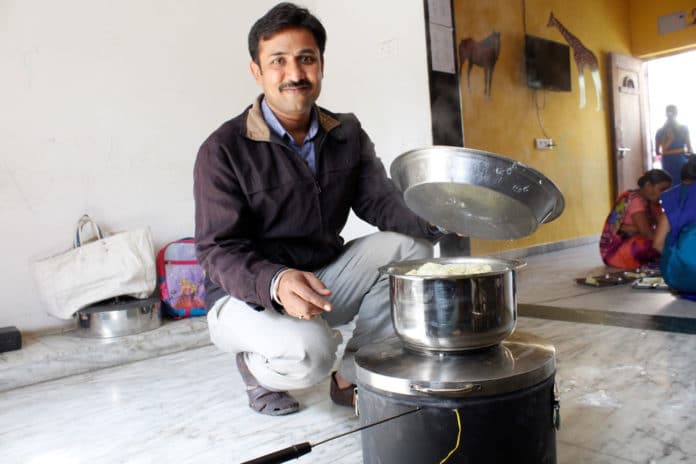 Dhaval with one of the prototypes of the solar stove. Imaget: Dhaval Thakkar
