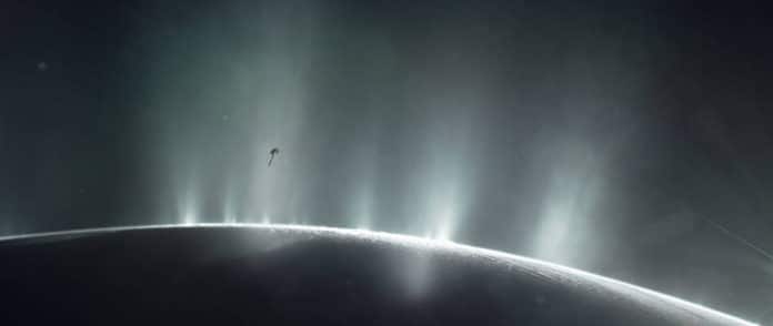 This illustration shows NASA’s Cassini spacecraft diving through the plume of Saturn’s moon Enceladus, in 2015. New research from the University of Washington, to be presented at the coming AbSciCon2019 conference, indicates that the moon’s subsurface ocean probably has higher than previously known concentrations of carbon dioxide and hydrogen and a more Earthlike pH level, possibly providing conditions favorable to life.NASA