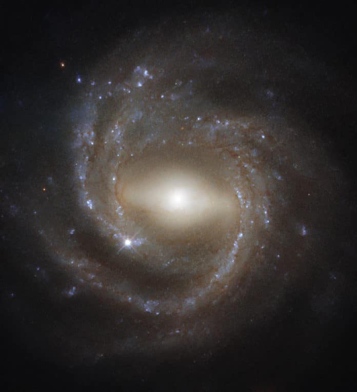 This Hubble image shows the barred spiral galaxy NGC 7773. The image is made up of observations from Hubble’s Wide Field Camera 3 (WFC3) in the infrared and optical parts of the spectrum. Three filters were used to sample various wavelengths. The color results from assigning different hues to each monochromatic image associated with an individual filter. Image credit: NASA / ESA / Hubble / J. Walsh.