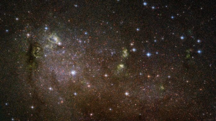 This image shows an irregular galaxy named IC 10, a member of the Local Group — a collection of over 50 galaxies in our cosmic neighborhood that includes the Milky Way.