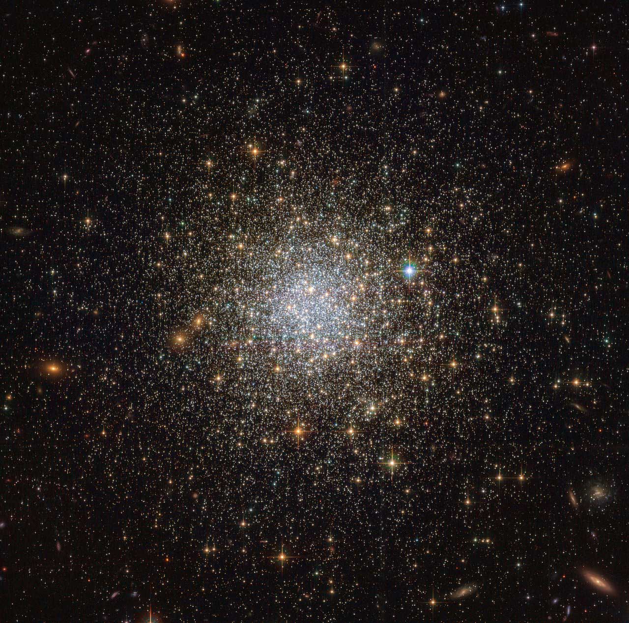 This image from the NASA/ESA Hubble Space Telescope reveals an ancient, glimmering ball of stars called NGC 1466. It is a globular cluster — a gathering of stars all held together by gravity — that is slowly moving through space on the outskirts of the Large Magellanic Cloud, one of our closest galactic neighbours. Credit: ESA/Hubble & NASA