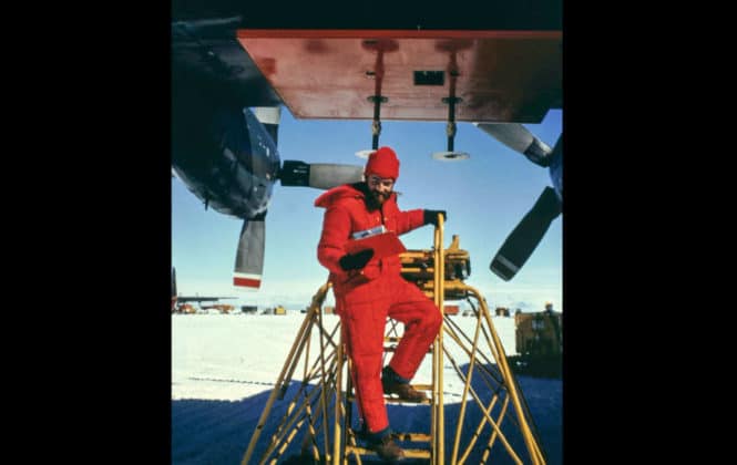 Nils Sko undertaking maintenance on a 300MHz radar antenna on a C-130 plane at McMurdo Sound in Antarctica