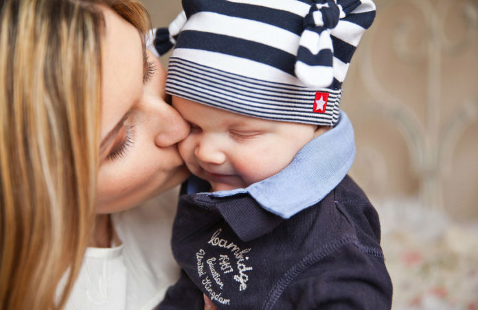 Unhappy mothers talk more to their baby boys