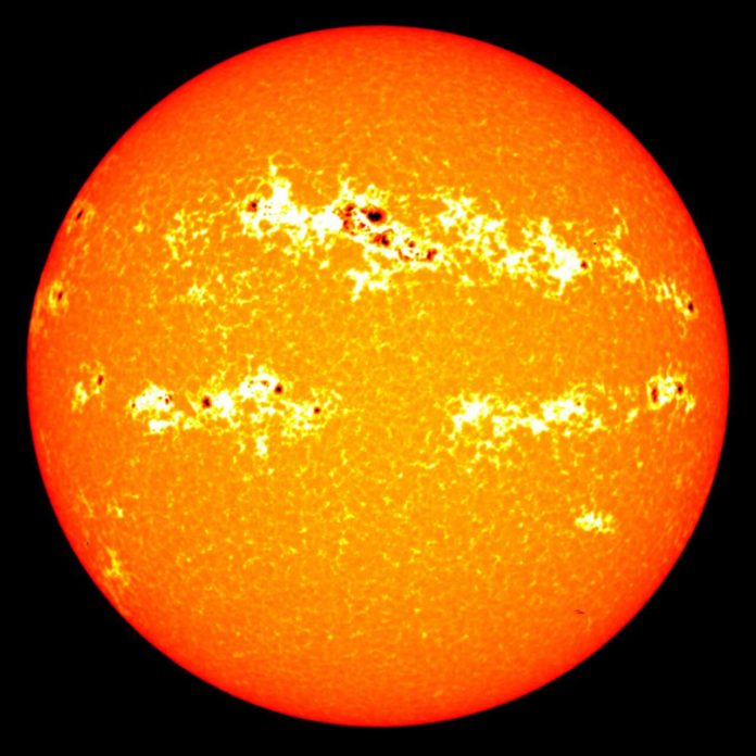 Sunspots can be seen on this image of solar radiation. Each sunspot lasts a few days to a few months, and the total number peaks every 11 years. The darker spots accompany bright white blotches, called faculae, which increase overall solar radiation. Credit: NASA/Goddard/SORCE