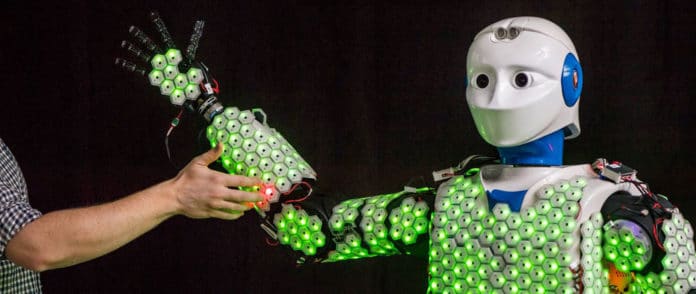 Thanks to the synthetic skin developed by Prof. Gordon Cheng and his team, robot H-1 is able to feel the touch of a human. New control algorithms made it possible for the first time to apply artificial skin to a human-sized robot. Image: Astrid Eckert / TUM