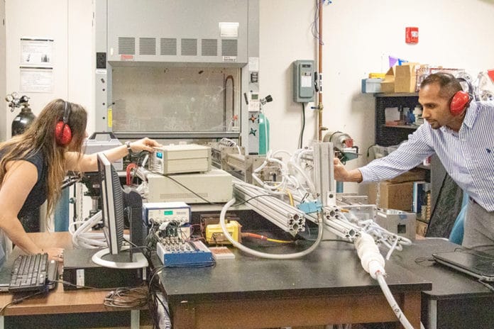 Jessica Chambers, a doctoral student in the University of Central Florida’s Department of Mechanical and Aerospace Engineering, and Kareem Ahmed, an assistant professor in UCF’s Department of Mechanical and Aerospace Engineering, set up the turbulent shock tube they used to help uncover the mechanisms that could have caused the Big Bang.