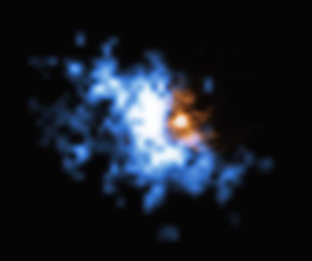 This image shows one of the gas halos newly observed with the MUSE instrument on ESO’s Very Large Telescope superimposed to an older image of a galaxy merger obtained with ALMA. The large-scale halo of hydrogen gas is shown in blue, while the ALMA data is shown in orange.  The halo is bound to the galaxy, which contains a quasar at its centre. The faint, glowing hydrogen gas in the halo provides the perfect food source for the supermassive black hole at the centre of the quasar.  The objects in this image are located at redshift 6.2, meaning they are being seen as they were 12.8 billion years ago. While quasars are bright, the gas reservoirs around them are much harder to observe. But MUSE could detect the faint glow of the hydrogen gas in the halos, allowing astronomers to finally reveal the food stashes that power supermassive black holes in the early Universe.