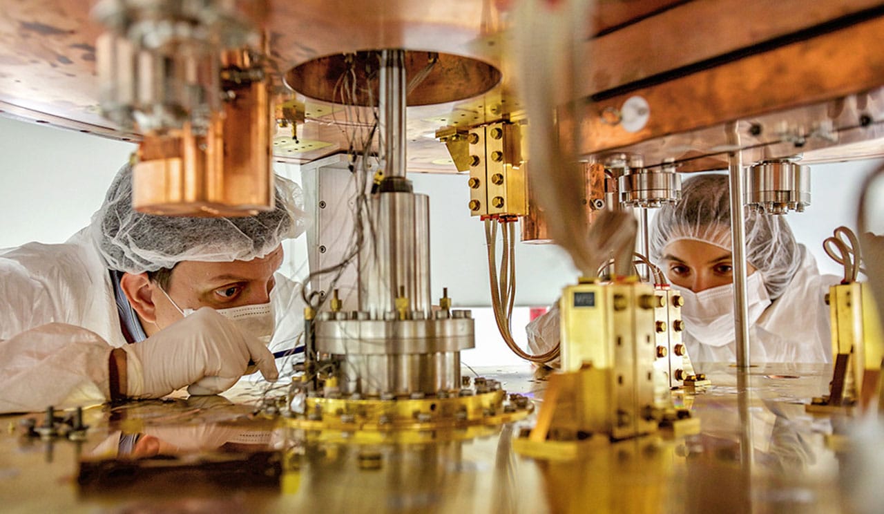 Researchers work on the cryostat for the CUORE experiment. (Credit: CUORE Collaboration)